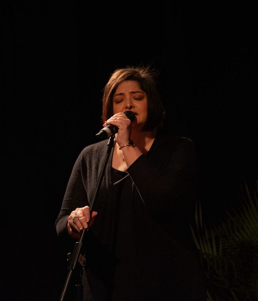 Intimate moment singing into the microphone.
