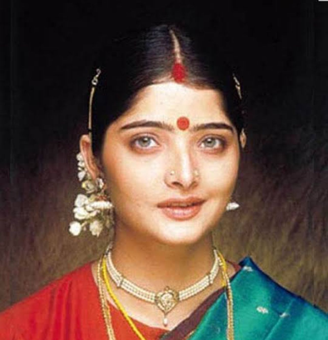 Classical portrait of Vasundhara Das in traditional attire.